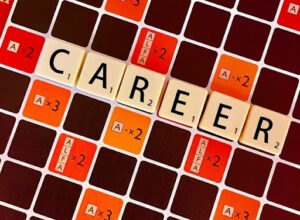 the letters CAREER on a Scrabble board